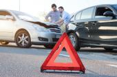 Two men reporting a car crash for the insurance claim 691472899
