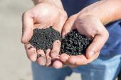 Rubber crumb in the hands of man.