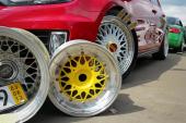 Moscow. Russia - May 20, 2019: colorful BBS wheels near red tuned hatchback which parked on the street